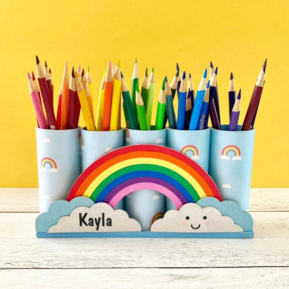 a rainbow pencil holder with different colored pencils