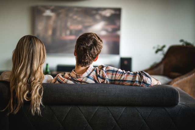 couple watching running film