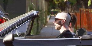 *EXCLUSIVE* Adam Levine sports shaved sides and cornrows while out driving his vintage Ferrari