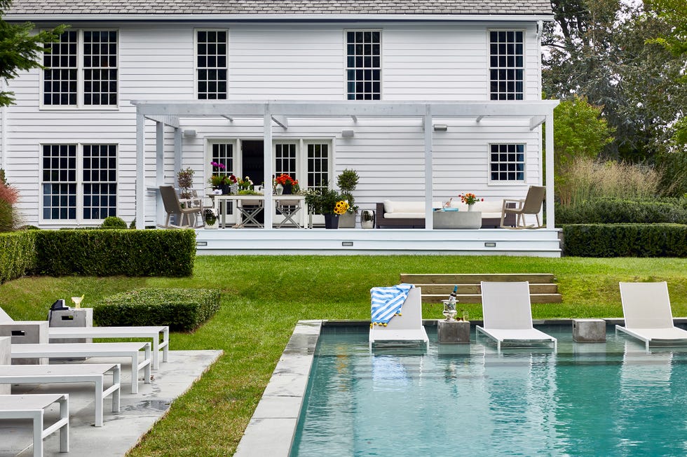 pool with baja shelf and patio dining area