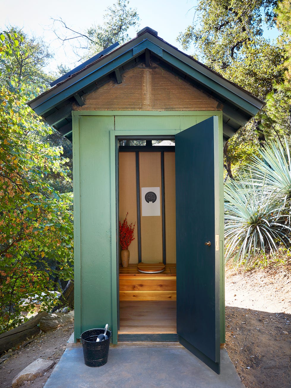 stylish backyard outhouse