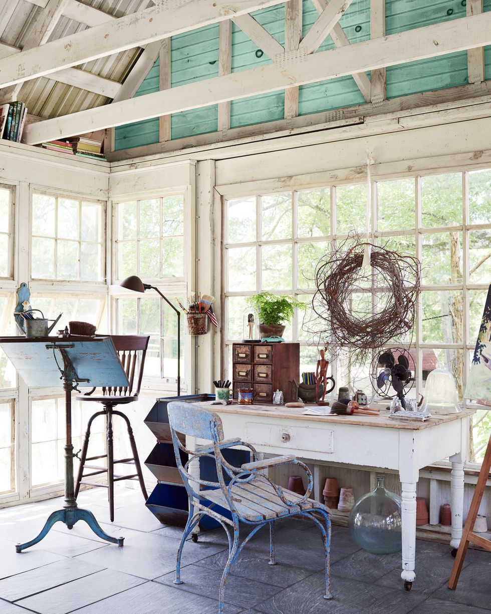 artist studio in white salvaged window wrapped backyard retreat