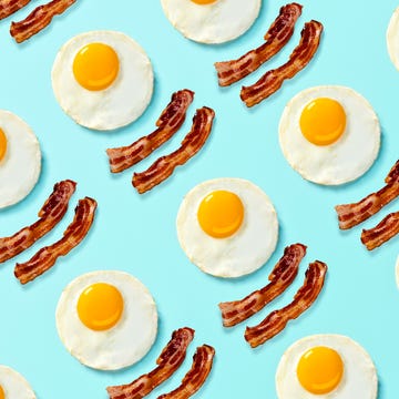 breakfast bacon and eggs pop art on a bright light blue background