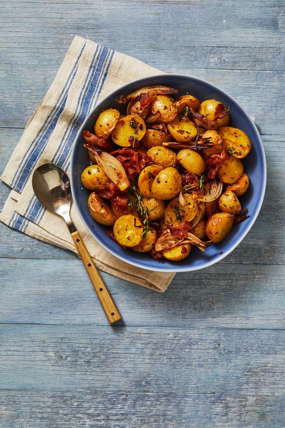bacon roasted potatoes in a blue bowl