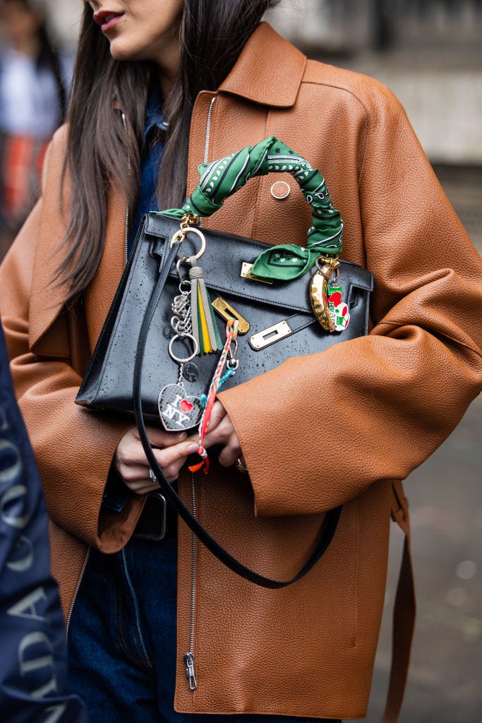 paris, france march 02 leia sfez wears black bag, brown jacket, denim shirt, belt, jeans outside hermes during the womenswear fallwinter 20242025 as part of paris fashion week on march 02, 2024 in paris, france photo by christian vieriggetty images