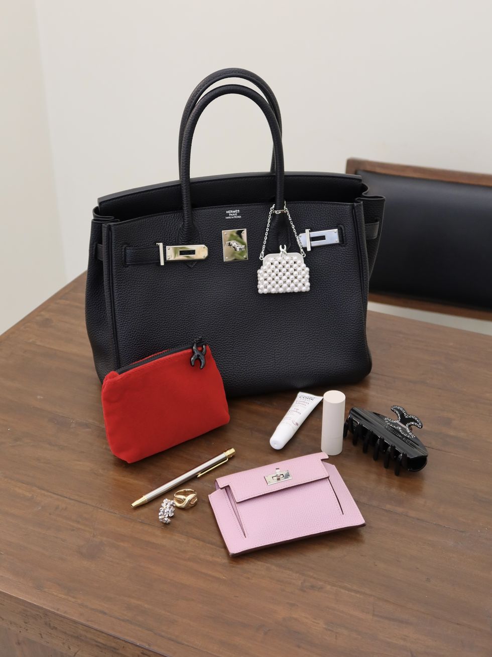 a purse and some keys on a table