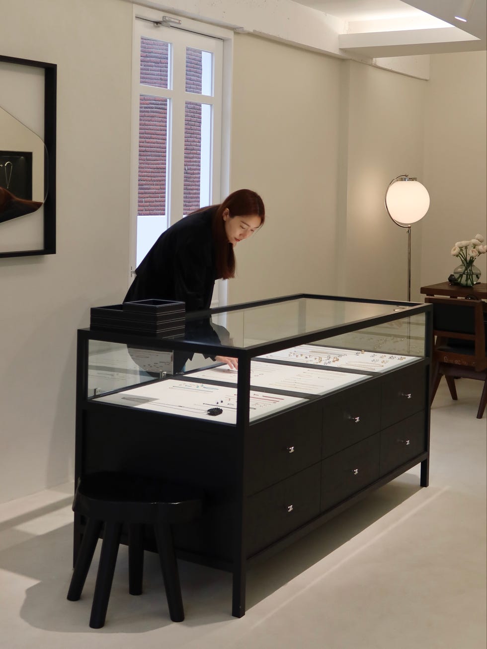 a person standing behind a desk