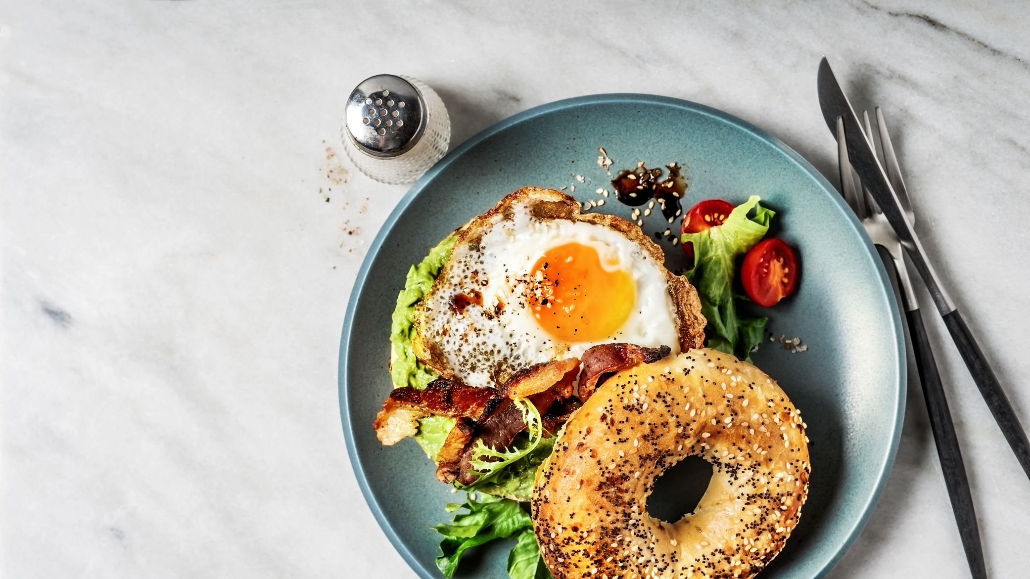 https://hips.hearstapps.com/hmg-prod/images/bagel-sandwich-with-avocado-fried-egg-and-side-royalty-free-image-1584725317.jpg?crop=1xw:0.81315xh;center,top