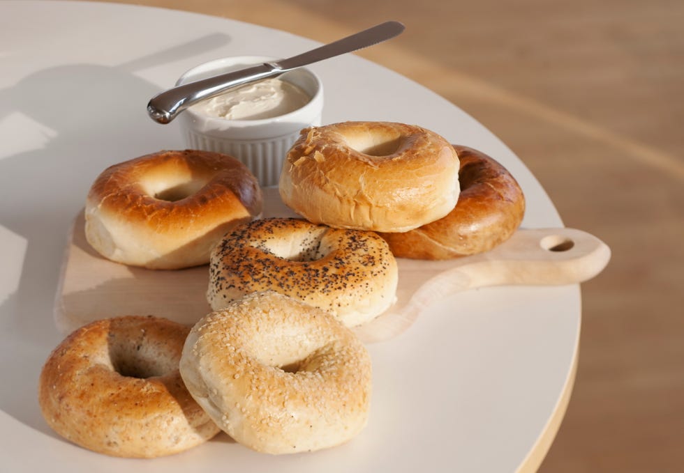 bagels and cream cheese on table