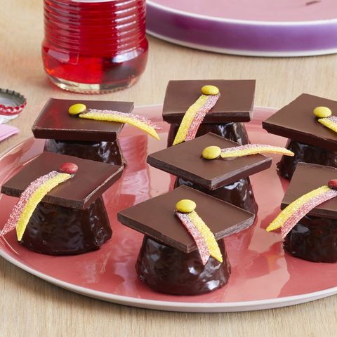 graduation brownie bites with chocolate and candy grad hats