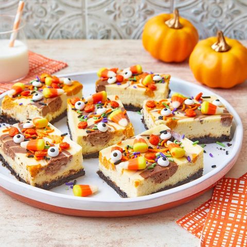 halloween cheesecake bars with candy eyes and candy corn