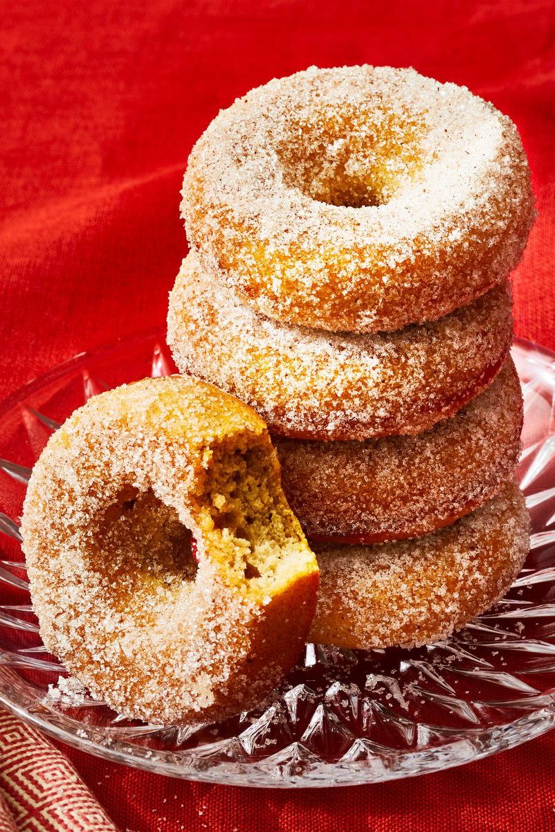 baked applesauce donuts on a glass plate