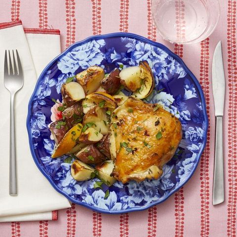 lemon thyme sheet pan chicken and potatoes on blue plate