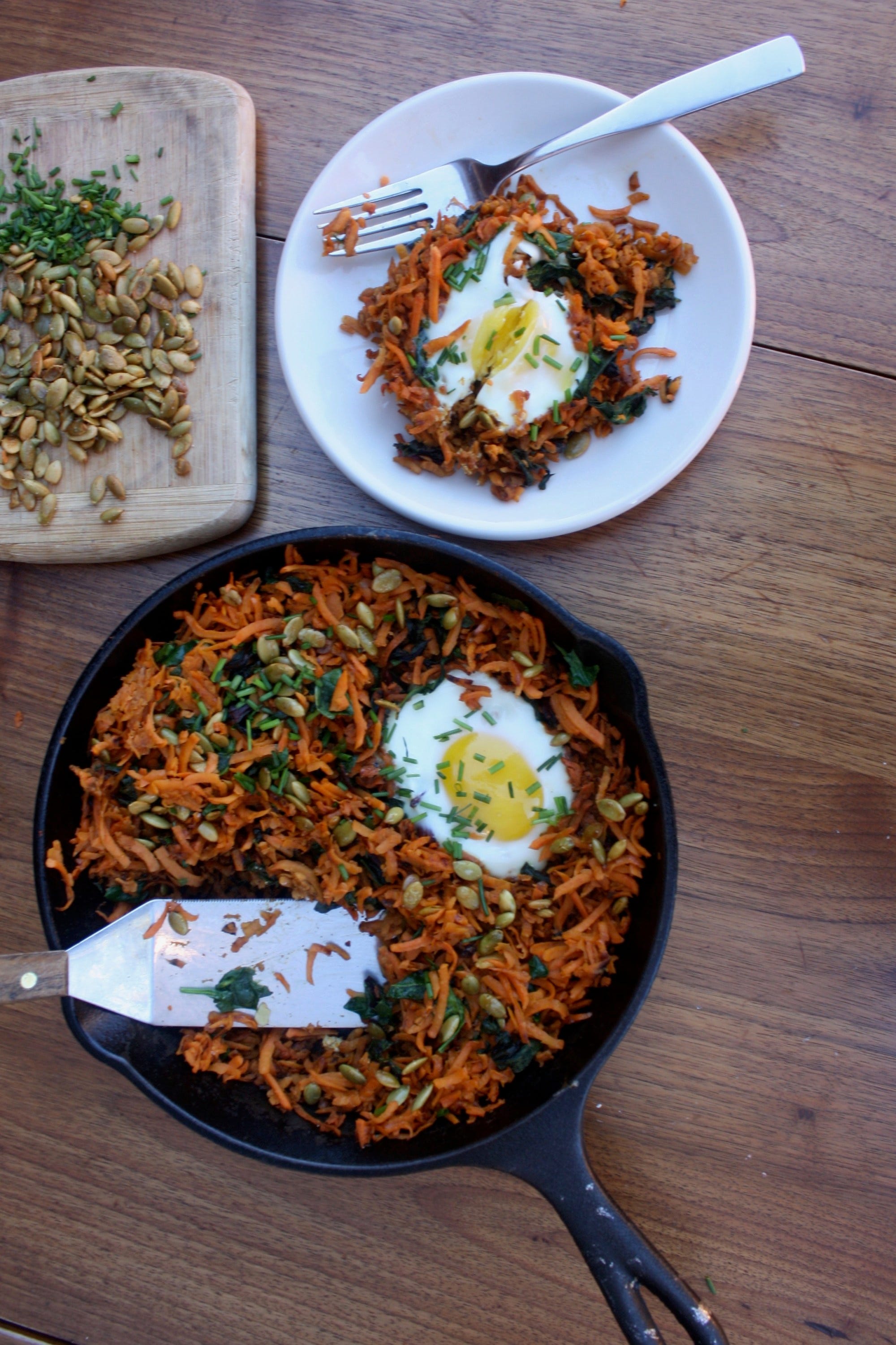Baked eggs with sweet potato has and pumpkin seeds
