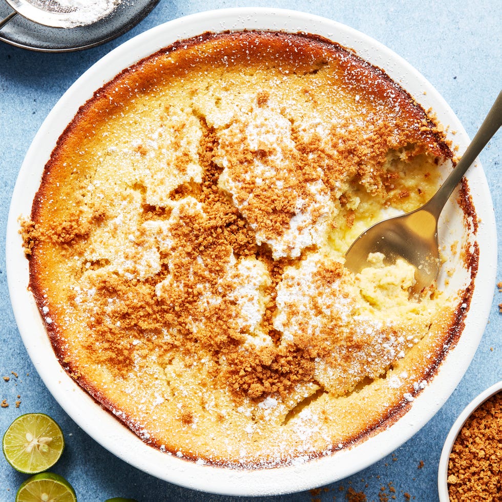 baked key lime pie pudding topped with whipped cream and lime zest
