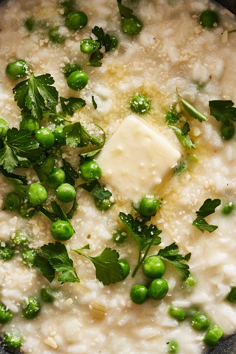 closeup of baked risotto with lemon, parmesan, and peas