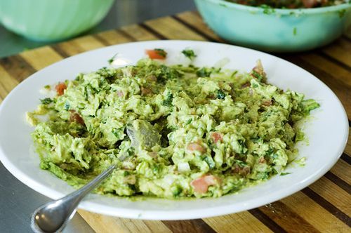 https://hips.hearstapps.com/hmg-prod/images/baked-potato-toppings-guacamole-1594407082.jpg