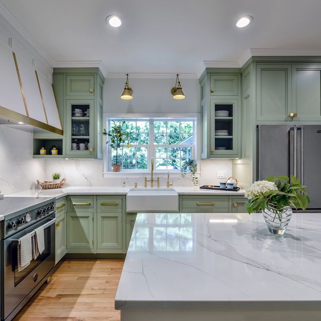 a kitchen with green cabinets
