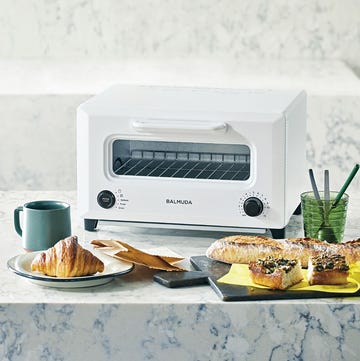 a table with food and a microwave