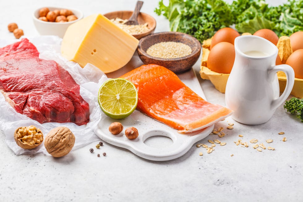 balanced diet food background protein foods fish, meat, cheese, quinoa, nuts on white background