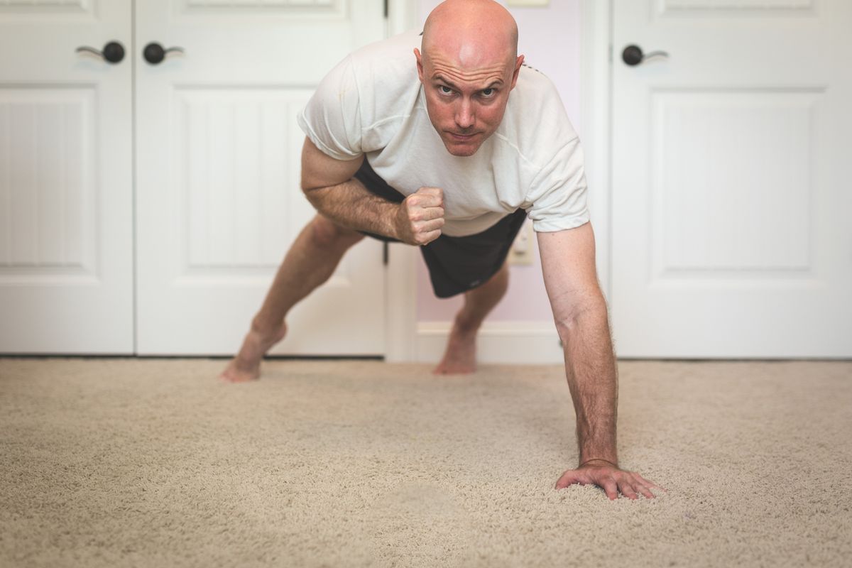 bald man exercising