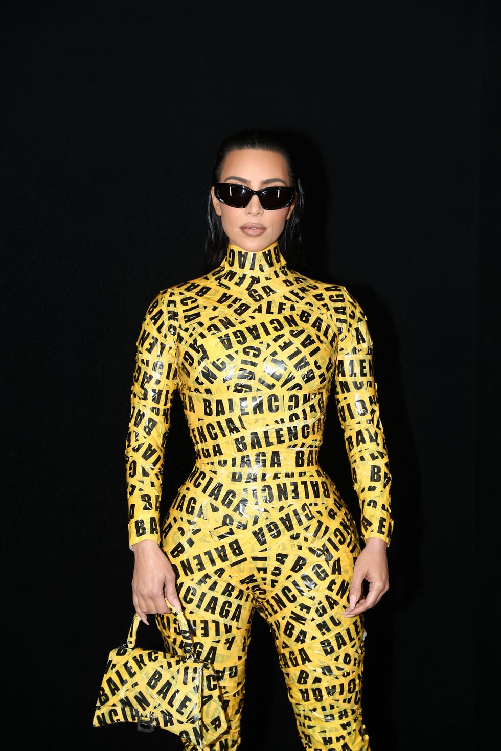 Kim Kardashian Sparkles With Balenciaga Bag and Catsuit at 818 Launch – WWD