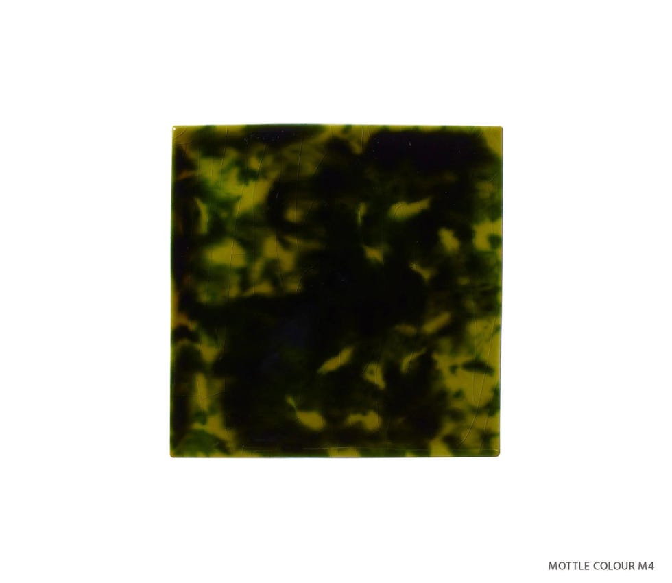 square piece of mottled green and black material