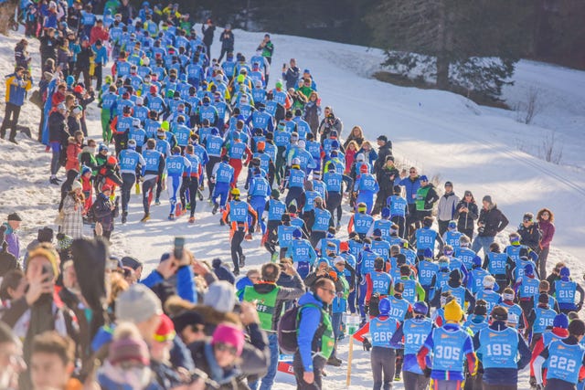 a group of people on a snowy hill