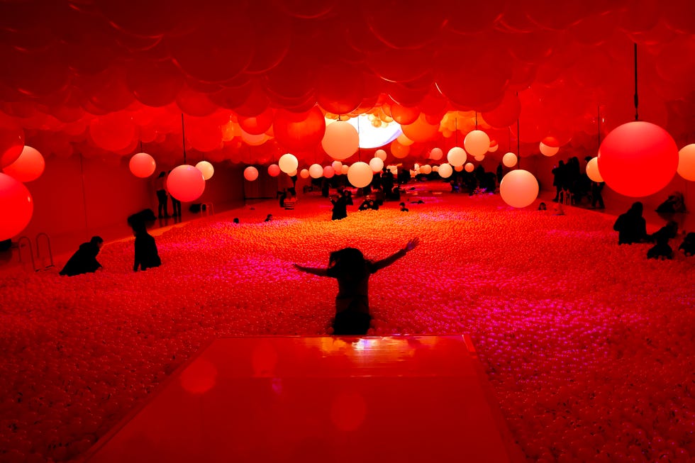 a group of people holding balloons