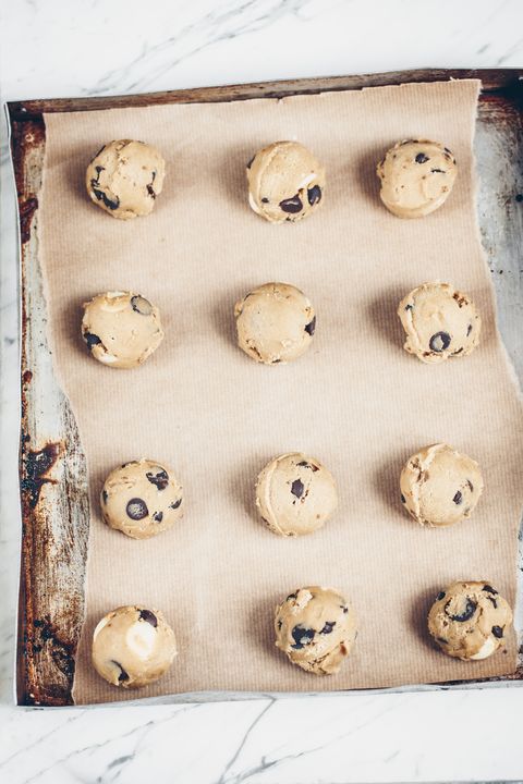 Balls of cookie dough on a baking sheet