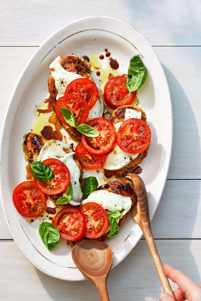 balsamic chicken caprese with sliced mozzarella on a white plate