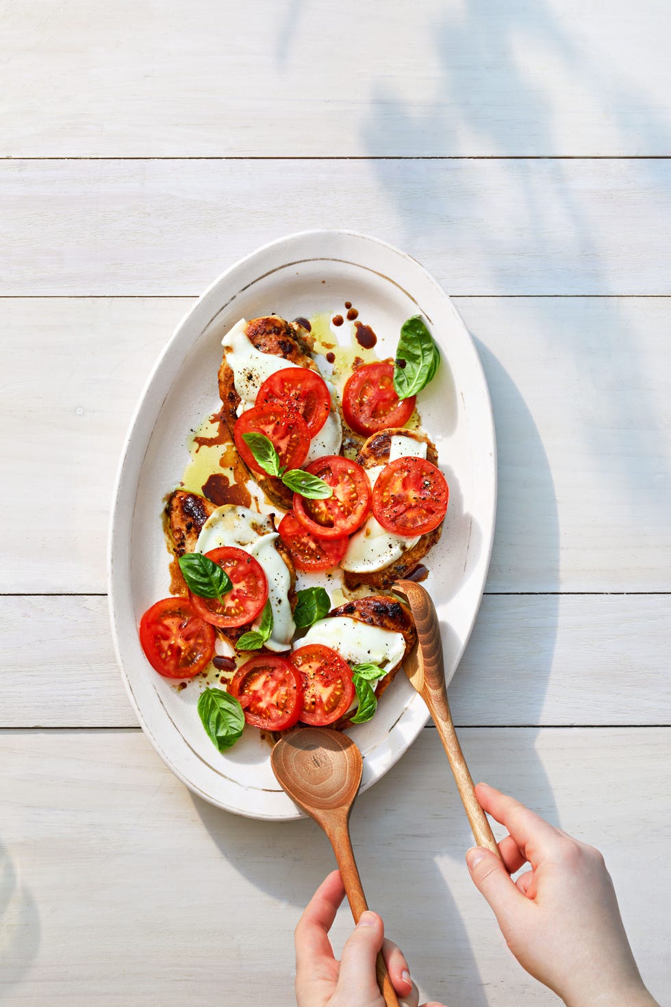 balsamic chicken caprese on a white plate