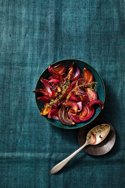 balsamic roasted red onions in a blue bowl