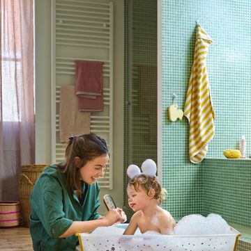 a woman and a child in a bathtub