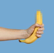 hand holding a banana