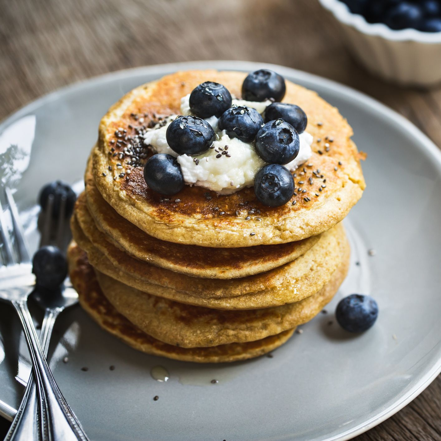 Banana Oat Pancakes with Blueberries, Coconut cream and Chia topping