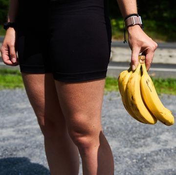 a runner holding a bunch of bananas