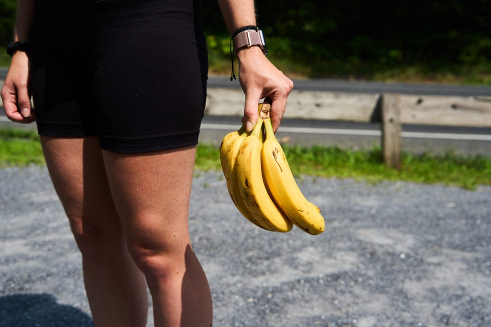 a runner holding a bunch of bananas