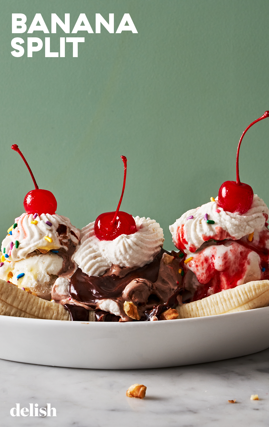 banana split with chocolate sauce and strawberry syrup
