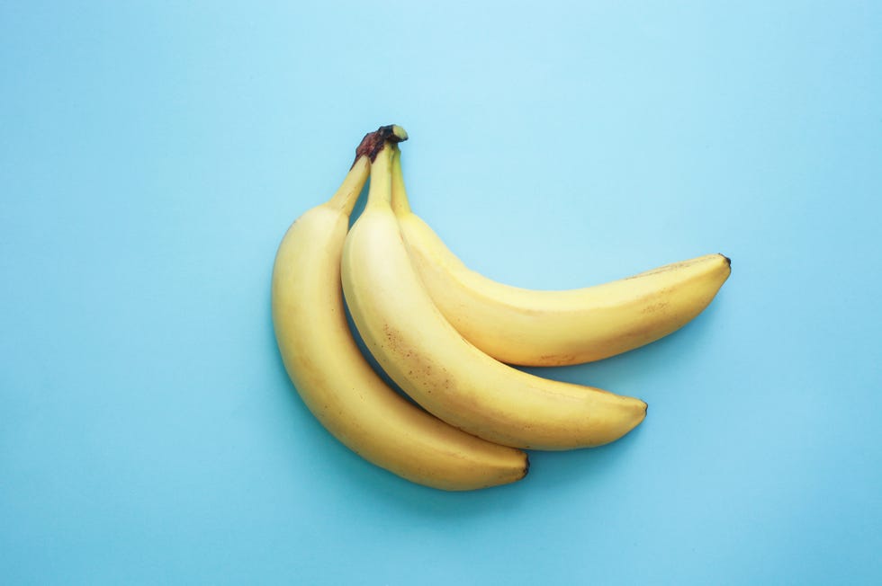 banana yellow fruits over blue background