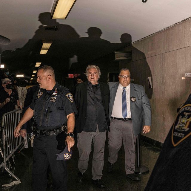donald trump's former advisor steve bannon c is led away from a new york court in handcuffs on september 8, 2022   bannon, 68, was indicted on state charges of money laundering, conspiracy and fraud related to an alleged online scheme to raise money for the construction of the us mexico border wall photo by alex kent  afp photo by alex kentafp via getty images