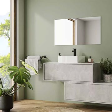 baño verde moderno con mueble de lavabo gris