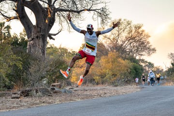 runner midjump on a racetrack
