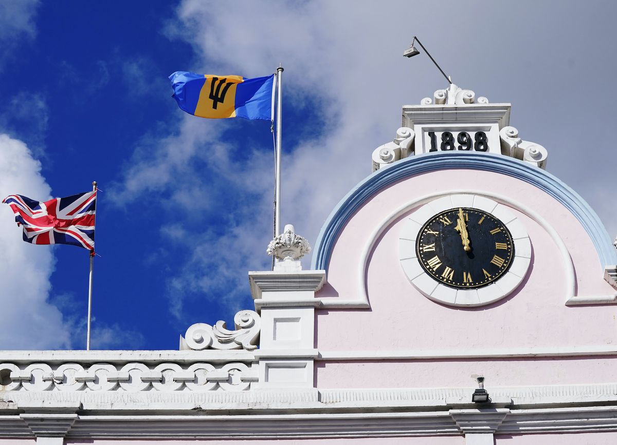 the flag of barbados flies next to the union flag over the colonnades shopping centre, bridgetown, barbados at midnight on november 29, 2021, barbados will officially become a republic in bridgetown, barbados picture date monday november 29, 2021 photo by jonathan bradypa images via getty images