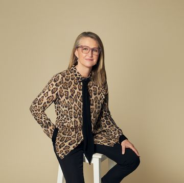 a person sitting on a stool