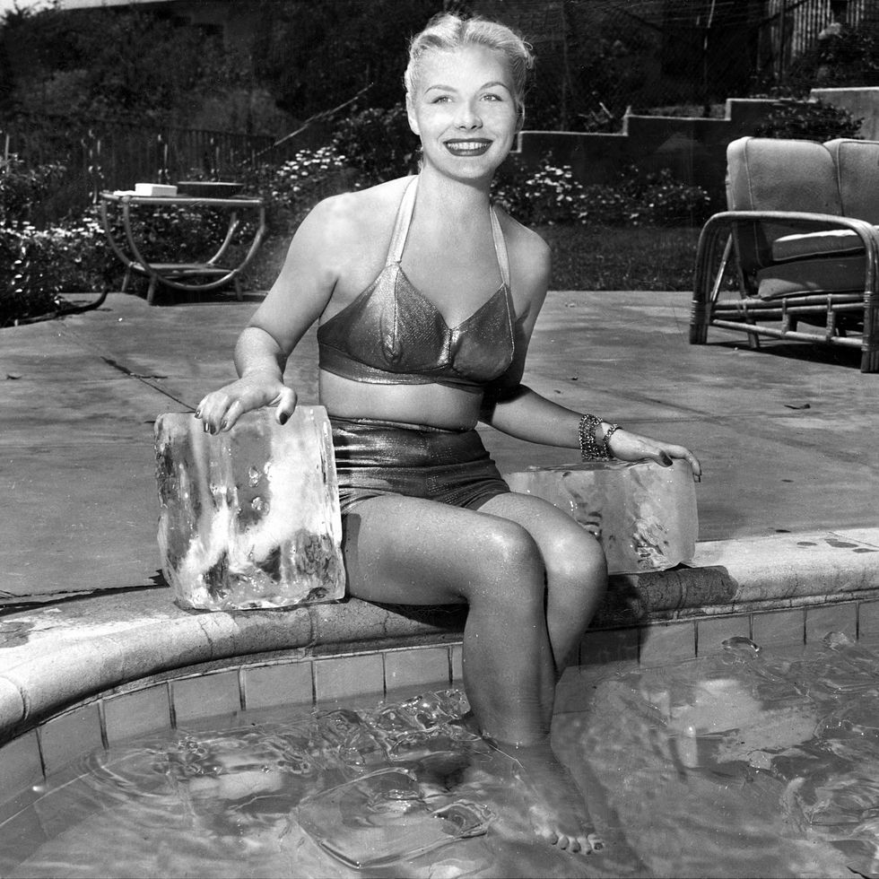 united states august 11: barbara payton, displaying her charm midst some cooling cubes, has been nominated by icemen "the girl they's mostt like to be trapped with in an ice manufacturing plant." now just by coincidence lovely barbara started a geat wave at the eagle lion studios where she is starring in her first major production, "trapped." (photo by ny daily news archive via getty images)