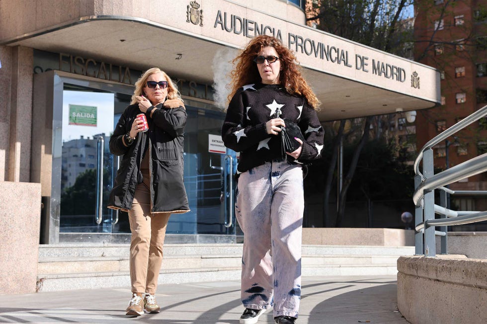 a couple of women standing on steps