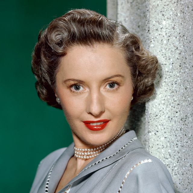 Barbara StanwyckBarbara Stanwyck (1907-1990), US actress, poses in a studio portrait, against a green background, circa 1950. (Photo by Silver Screen Collection/Getty Images)