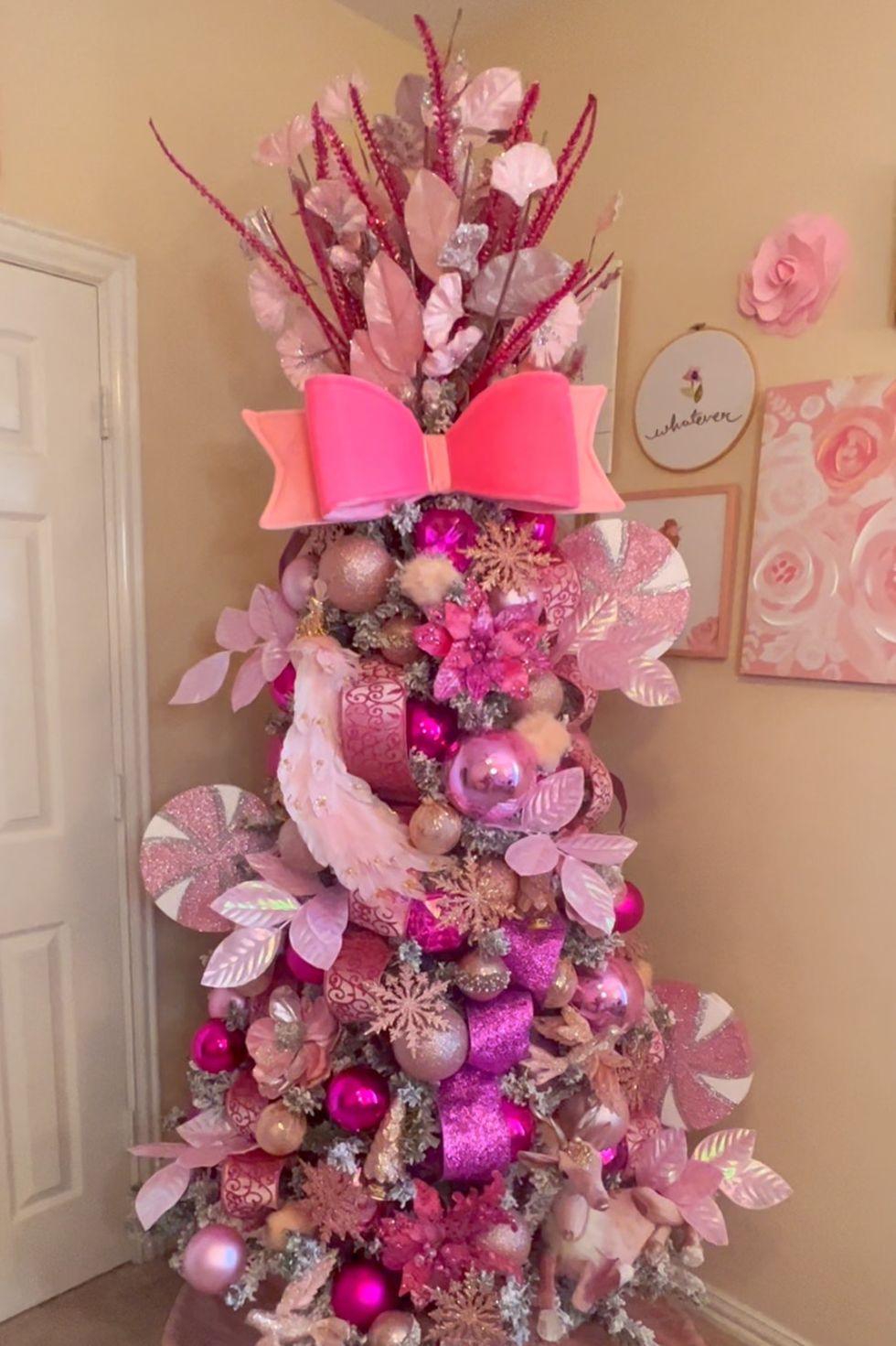 a decorated tree with pink and purple decorations