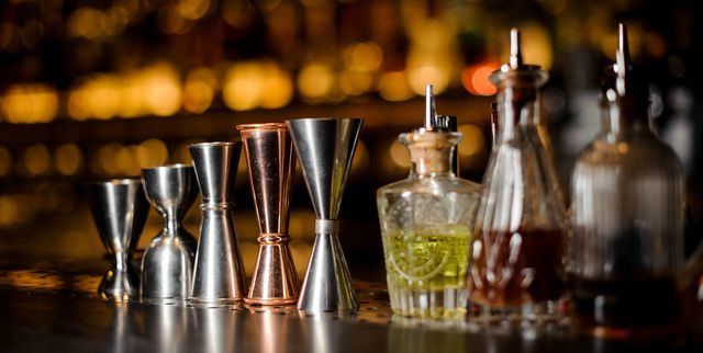 Barman equipment such as measuring cups and essence on the bar counter